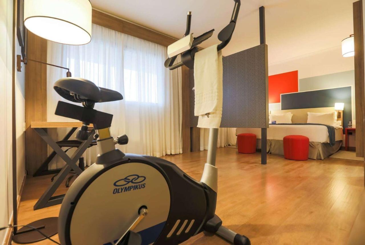 Tryp By Wyndham Ribeirao Preto Hotel Ngoại thất bức ảnh An exercise bike in a hotel room